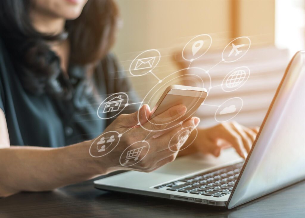 Stylized image of woman using a laptop with a superimposed digital advertising graphic