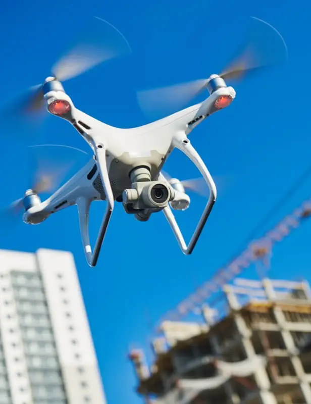 Image of an aerial drone flying over a construction site