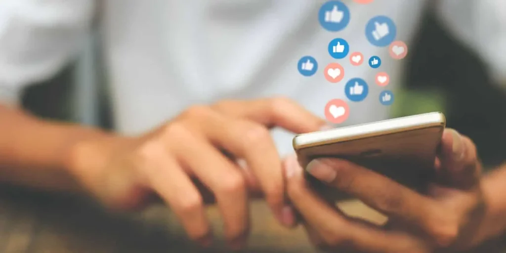 a phone with graphic social media icons representing social media trends as a business